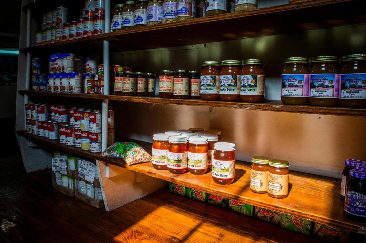 Light shines through a window Sept. 20 and hits a selection of jars and canned goods available at Wilson’s Grocery, located on Cramer Avenue in Lexington.