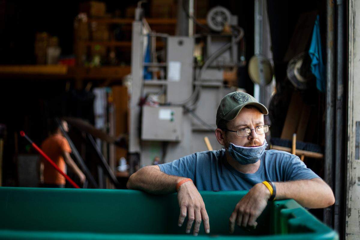 Warehouse Forman Paul Spicer rests on a container full of donations at the Methodist Mountain Mission in Jackson, Ky., Thursday, June 25, 2020. Spicer has worked for the mission for 12 years, his father and uncle also worked for the mission in the past. “There’s a purpose to this job, a lot of people depend on the mission,” Spicer said.