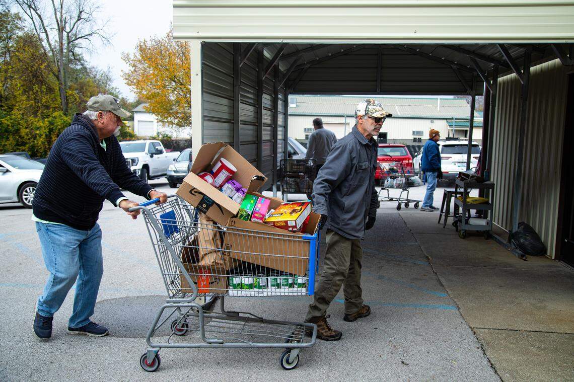 God's Outreach Food Pantry volunteers are receiving non-perishable donations from community members for delivery to food recipients on Nov. 3, 2025, in Richmond, Ky.