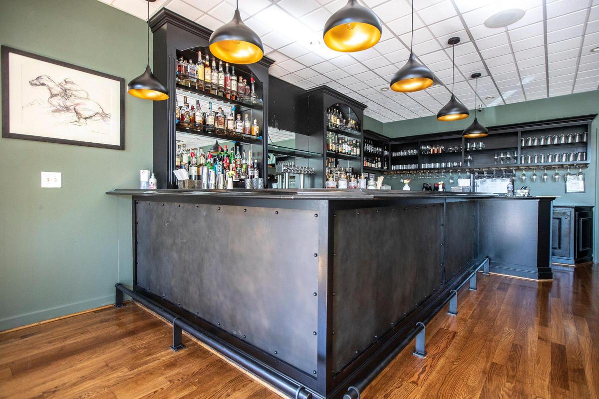 A bar at Distilled’s new location, which will have a familiar feel for regulars used to the look of the old restaurant, which closed Sept. 26, but with updated touches.
