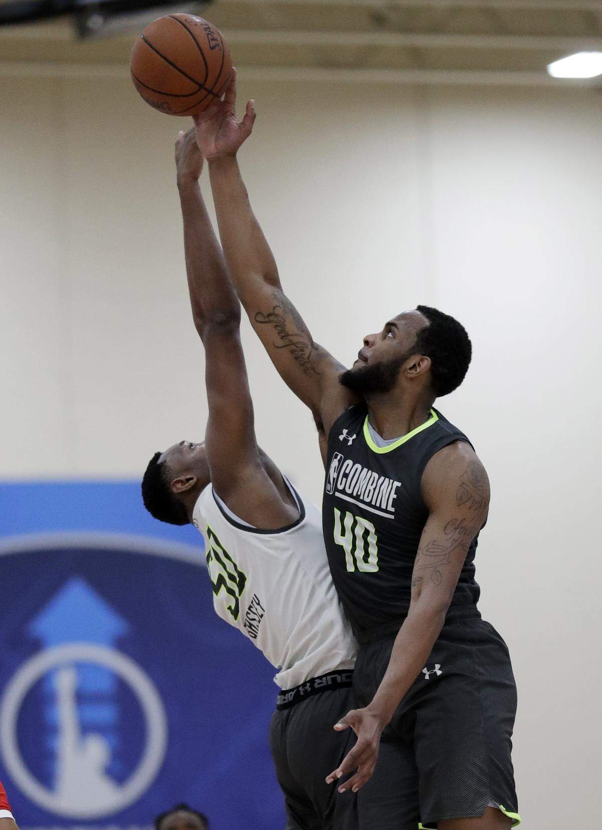 Western Kentucky's Charles Bassey, left, battled for a ball on the first day of the NBA Draft combine in Chicago on May 16.