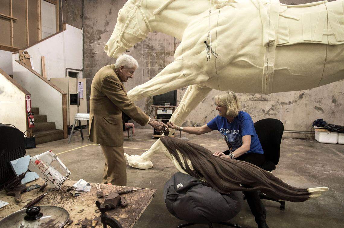 Jocelyn Russell removed the tail piece from the Secretariat foam molding and urged Alex Campbell to apply a few brush strokes of clay that had been warming in a crock pot. He took up a brush, painted a few strokes along the tail and said, “I am more than pleased.”