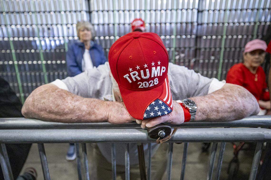 Jack Trumbo, 81, from Pleasureville, Ky., rests his head on his cane during President Donald Trump’s visit to Verst Logistics in Hebron, Kentucky, on Wednesday, March 11, 2026.