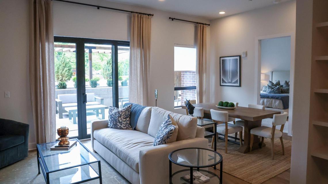 A living room and dining room in the new apartments at The Landing at Lakewood Harbour, shown Thursday, May 29, 2025 in Lexington, Ky. There are 101 high-end, one- and two-bedroom apartments in the development with vinyl plank flooring, in-unit laundry, and private balconies.