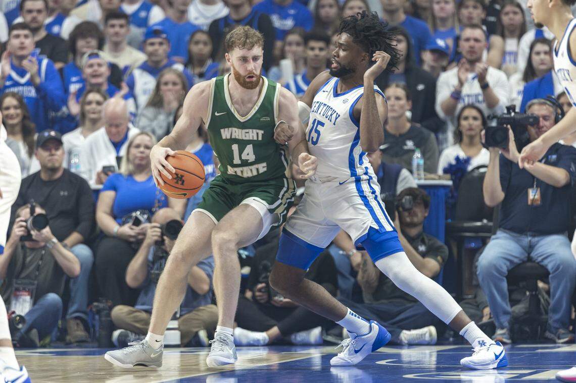 Kentucky forward Ansley Almonor plays defense against Wright State’s Brandon Noel, the Horizon League preseason player of the year, during last week’s season opener.