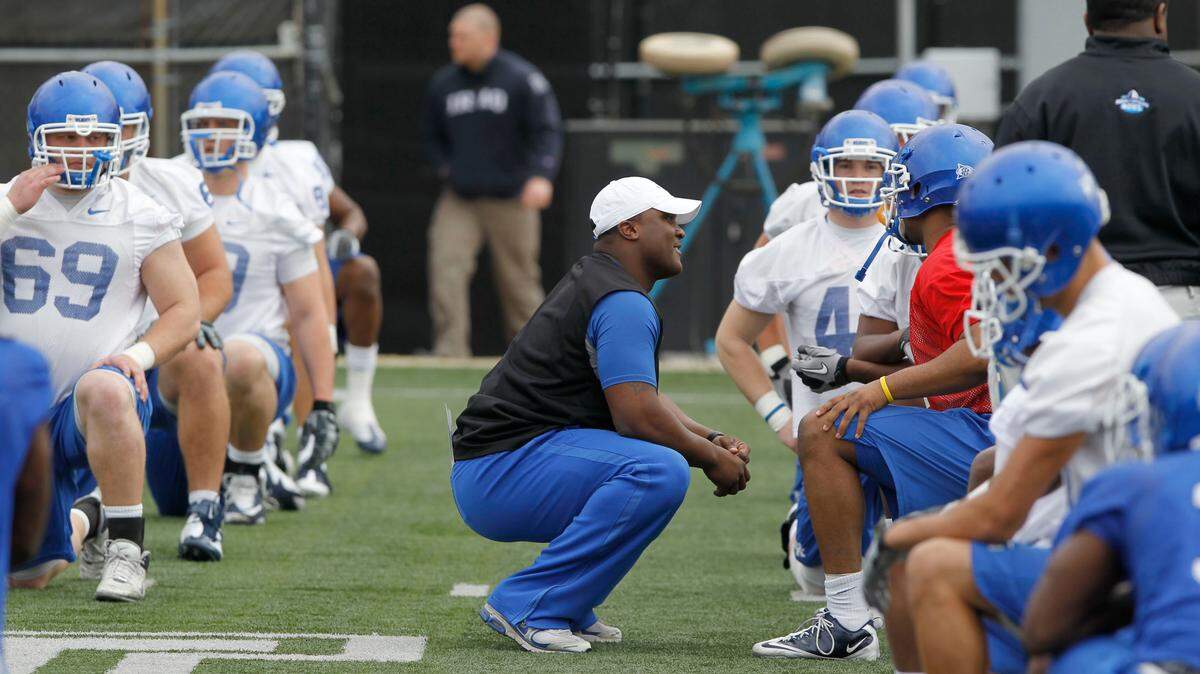 Tee Martin, Passing Game Coordinator and Wide Receivers coach, talked to players on the first day of the University of Kentucky spring football practice held at the Nutter Training Center on the UK campus in Lexington, Ky., Wednesday, March 23, 2011. Charles Bertram | Staff