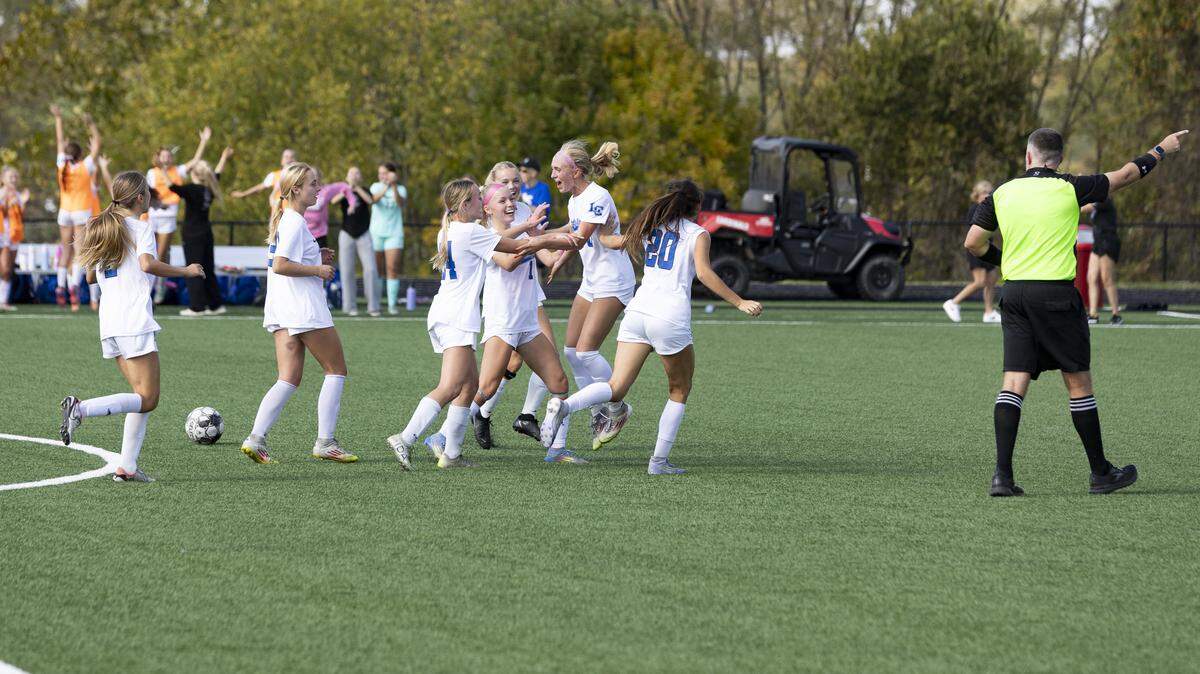 Lexington Catholic’s Joanna Bryant (10), second from right, celebrated her second half goal with her teammates during the 11th Region girls soccer tournament championship game against Paul Laurence Dunbar at Scott County High School in Georgetown on Saturday.