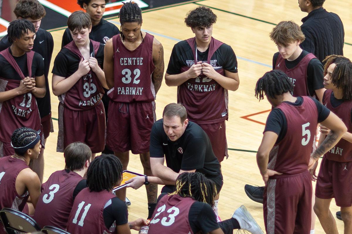 Tates Creek head coach Keaton Belcher talks to his players during a timeout in their game against Paul Laurence Dunbar on Thursday.