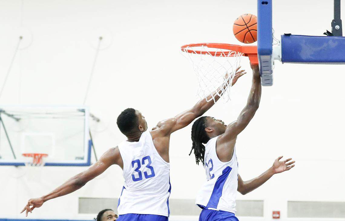Ugonna Onyenso contests a shot by fellow Kentucky freshman Cason Wallace during one of the Wildcats’ early preseason practices.