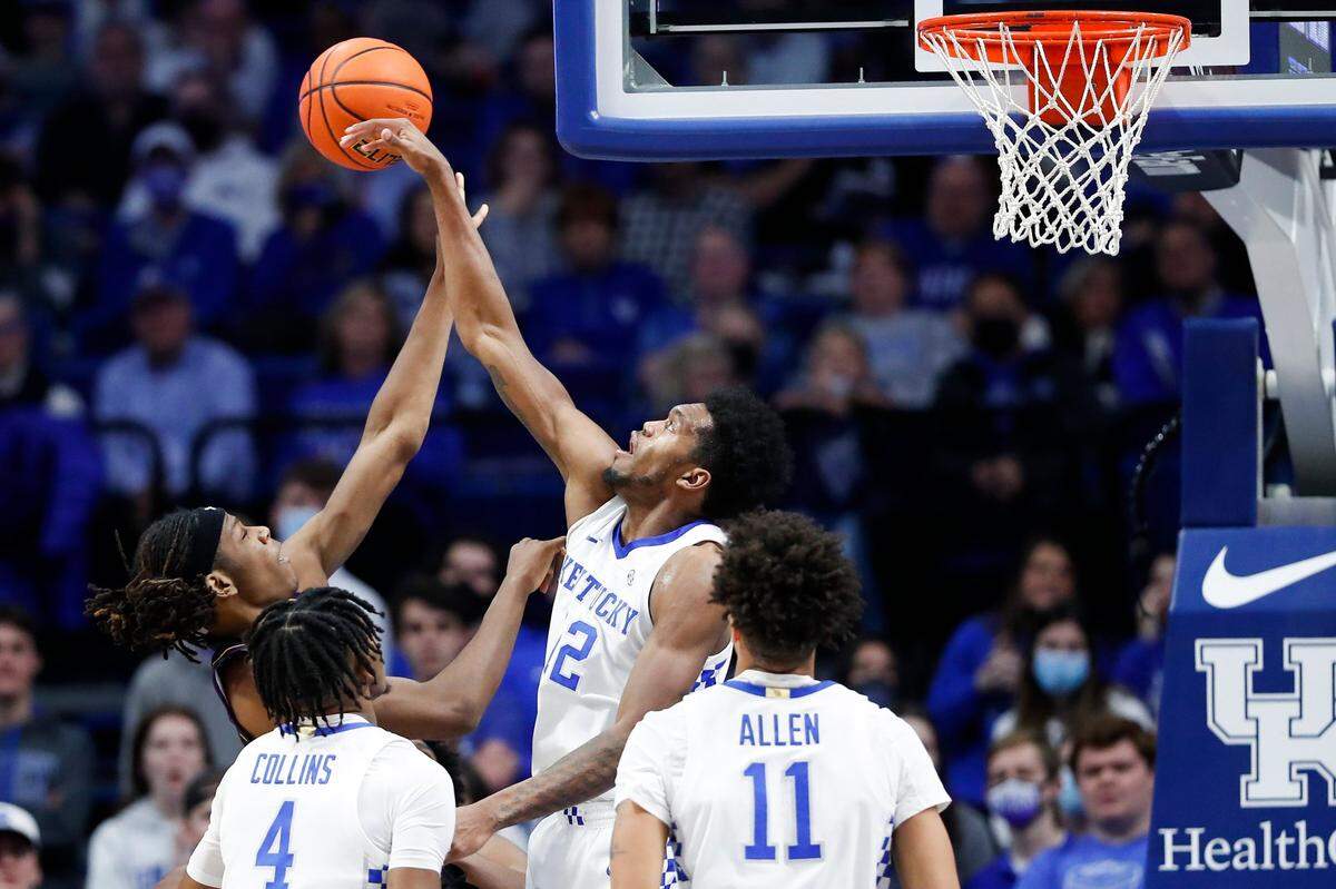 Kentucky forward Keion Brooks (12) blocked a shot by Albany forward Aaron Reddish (10) during Monday’s game at Rupp Arena. Brooks scored 17 points and grabbed eight rebounds.
