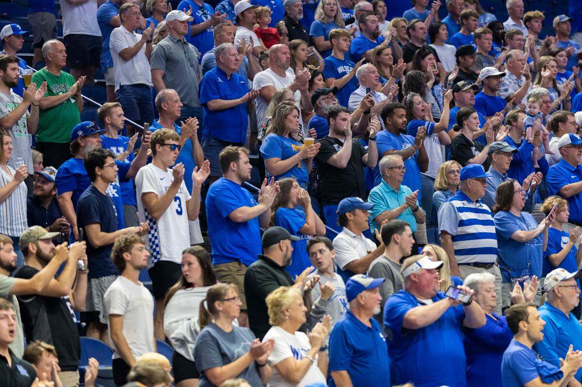 Fans inside Rupp Arena cheer for the La Familia team, which is predominantly made up of former Kentucky men’s basketball players, during a game against The Nawf during the TBT on Sunday at Rupp Arena.