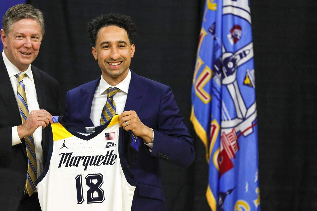 New Marquette Coach Shaka Smart, right, won seven NCAA Tournament games as head man at VCU but never won one as Texas coach.