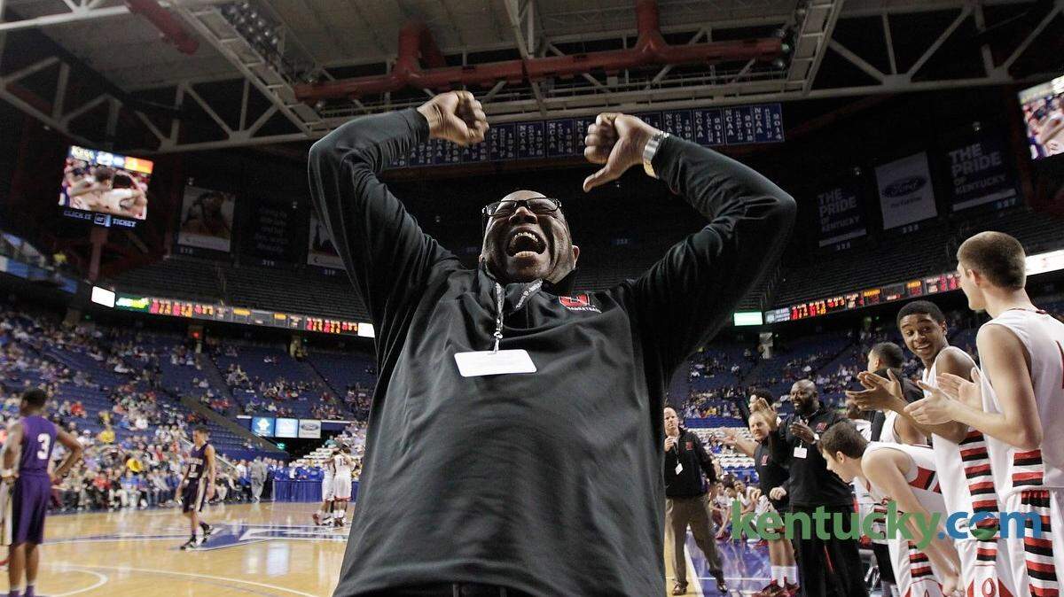 Owensboro head coach Rod Drake pumped up the student section in the last minute of the Whitaker Bank/KHSAA Boys' Sweet 16 State Championship Game between Bowling Green and Owensboro at at Rupp Arena in Lexington, Ky., on March 22, 2015. Owensboro beat Bowling Green 74-58 to win the state championship.  Photo by Pablo Alcala | Staff