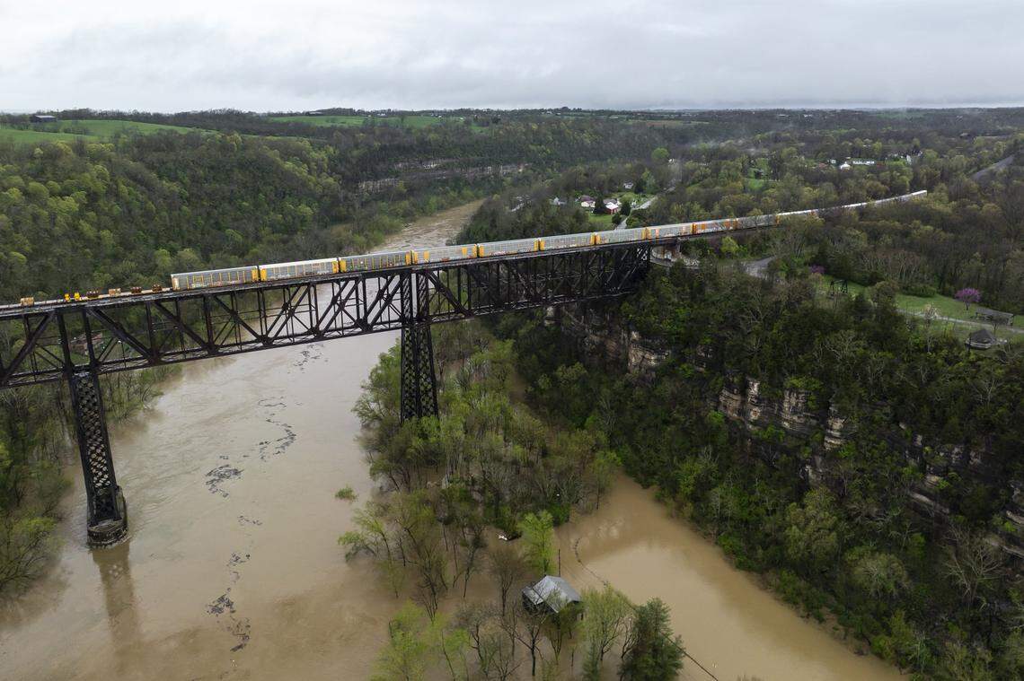 The Kentucky River surrounds homes on Dix Drive near High Bridge in Jessamine County on Saturday, April 5, 2025.