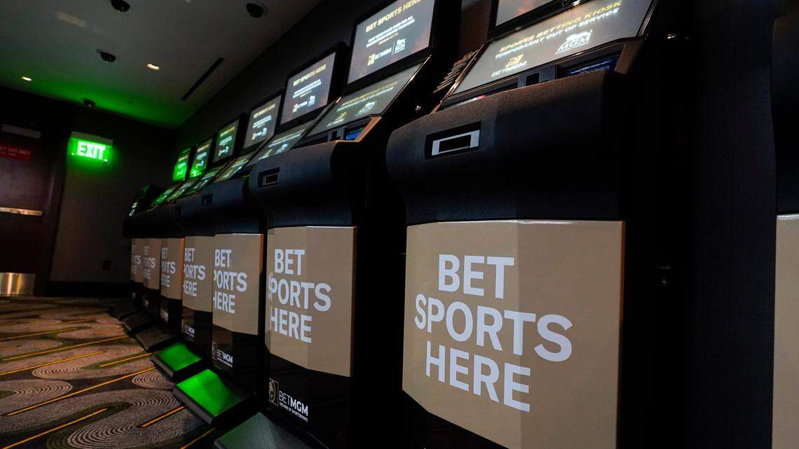 Betting kiosks are seen at the new MGM National Harbor sportsbook, Thursday, Dec. 9, 2021, in Oxon Hill, Md. Maryland officially started taking sports bets Thursday, when Larry Hogan was among the first people to make a sports wager at the casino. (AP Photo/Julio Cortez)