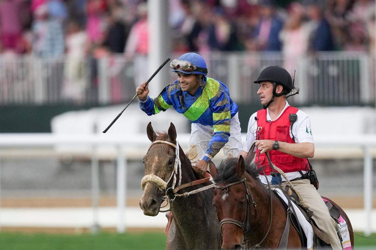 Jockey Luis Saez celebrates while aboard Secret Oath after their win in the Kentucky Oaks at Churchill Downs on Friday.