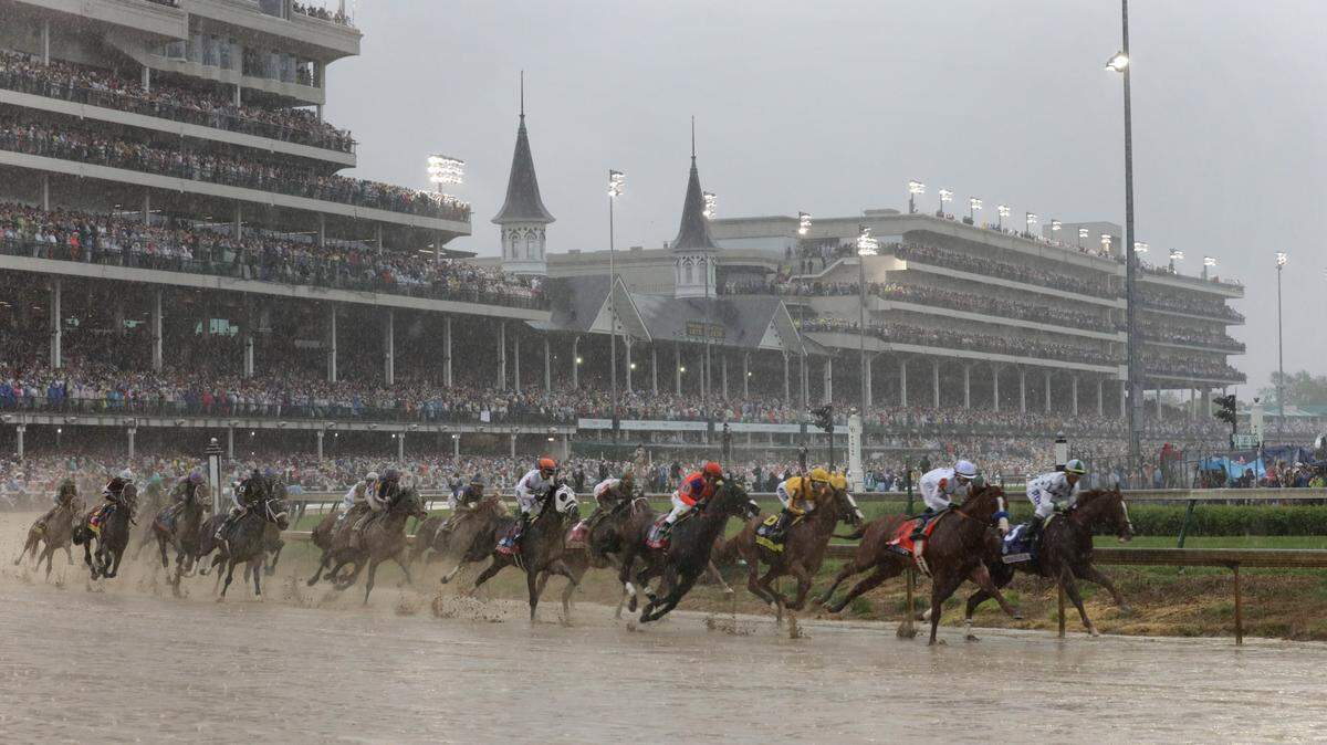 The field rounded the first turn with the Twin Spires of Churchill Downs in the background during the 144th running of the Kentucky Derby. Justify (7), with Mike Smith up, won.