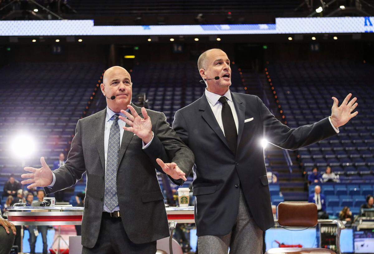 ESPN’s Seth Greenberg, left, and Jay Bilas try to explain a flagrant foul situation to fans during the “College GameDay” segment before a Kentucky-Kansas game in Rupp Arena in 2019.