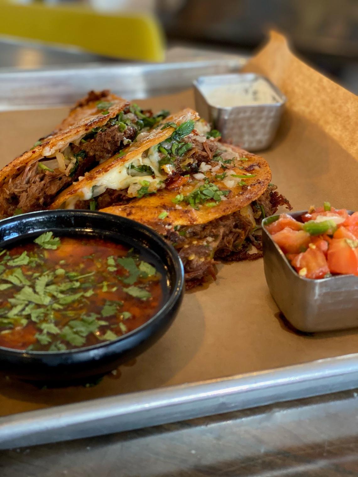 Birria tacos are one of the most popular dishes at Agave & Rye, which will be opening a second Lexington location downtown in the former Saul Good space at The Square. These are slow-braised beef with guajillo chilies, Oaxaca cheese, cilantro and onion and come with dipping consommé.