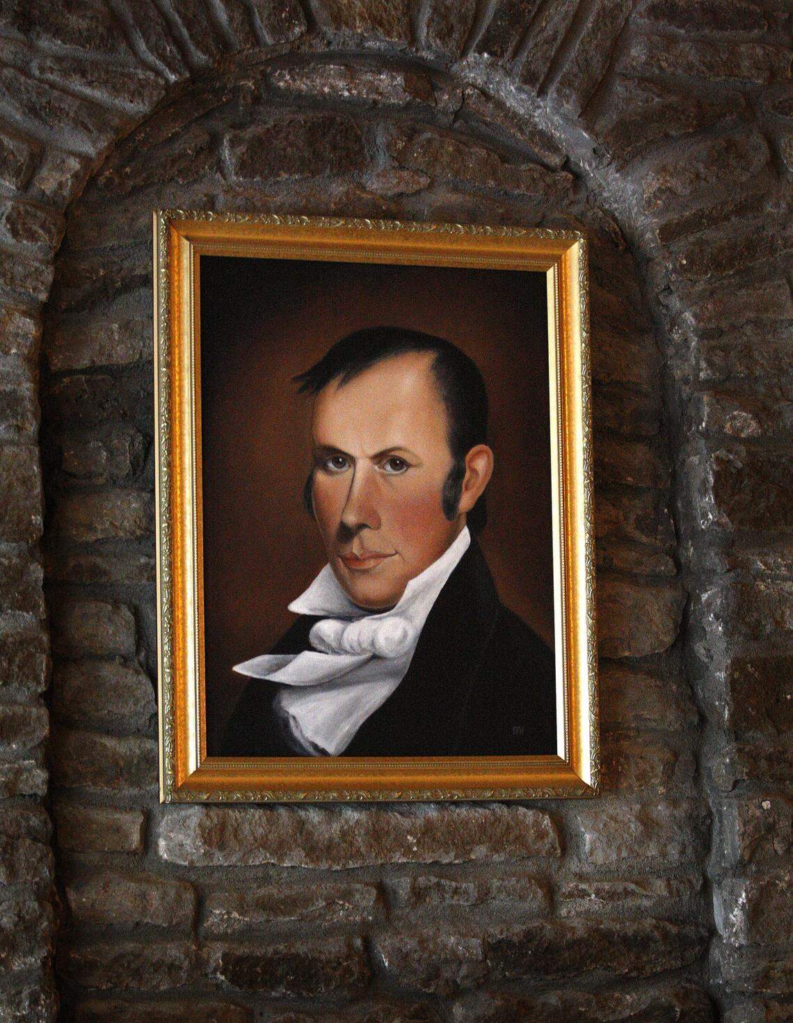 Portrait of Henry Clay hangs above the fireplace on opening night at Henry Clay Public House in Lexington.