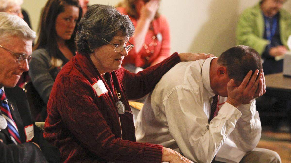 Margaret Winstandley, the mother of Michael Turpin, comforted her son Tony Turpin during a parole board victim's impact hearing in Frankfort as they listened to  testimony Monday about his brother's 1986 murder.       