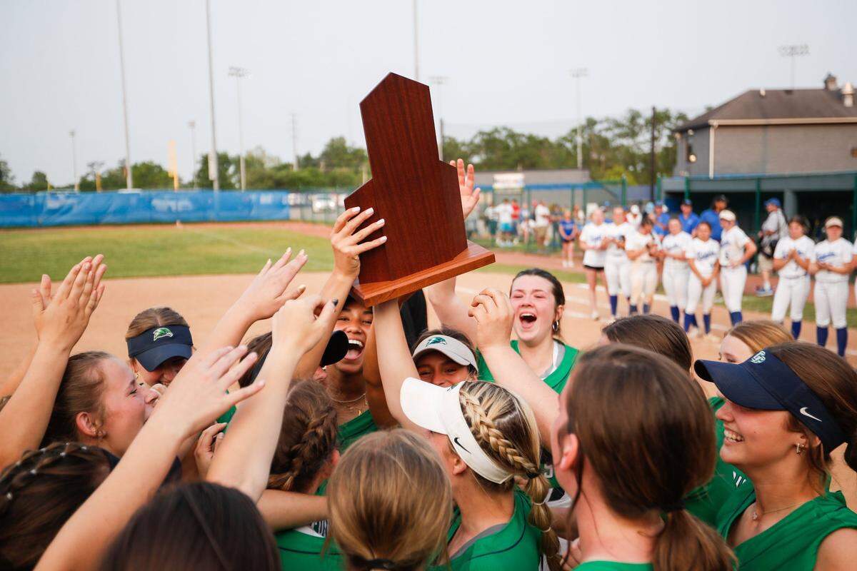 Great Crossing’s players celebrate their 11th Region Tournament softball championship after beating Lexington Catholic on Wednesday night at Henry Clay.