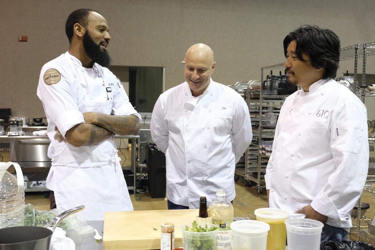 Host Tom Colicchio, with guest judge Ed Lee and chef Justin Sutherland, is stirring up some trash talk while the chefs prep.