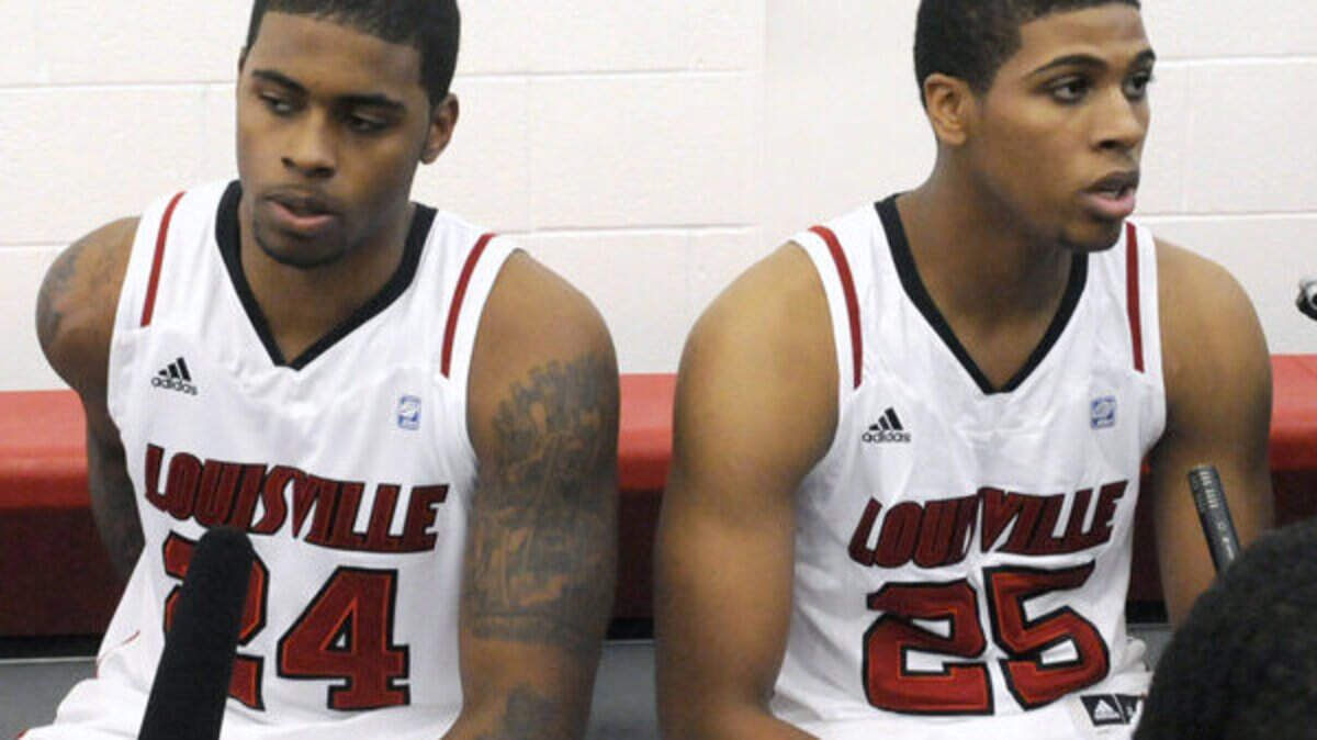 Louisville's Chane Behanan, left, and Wayne Blackshear talked to reporters during media day last year.