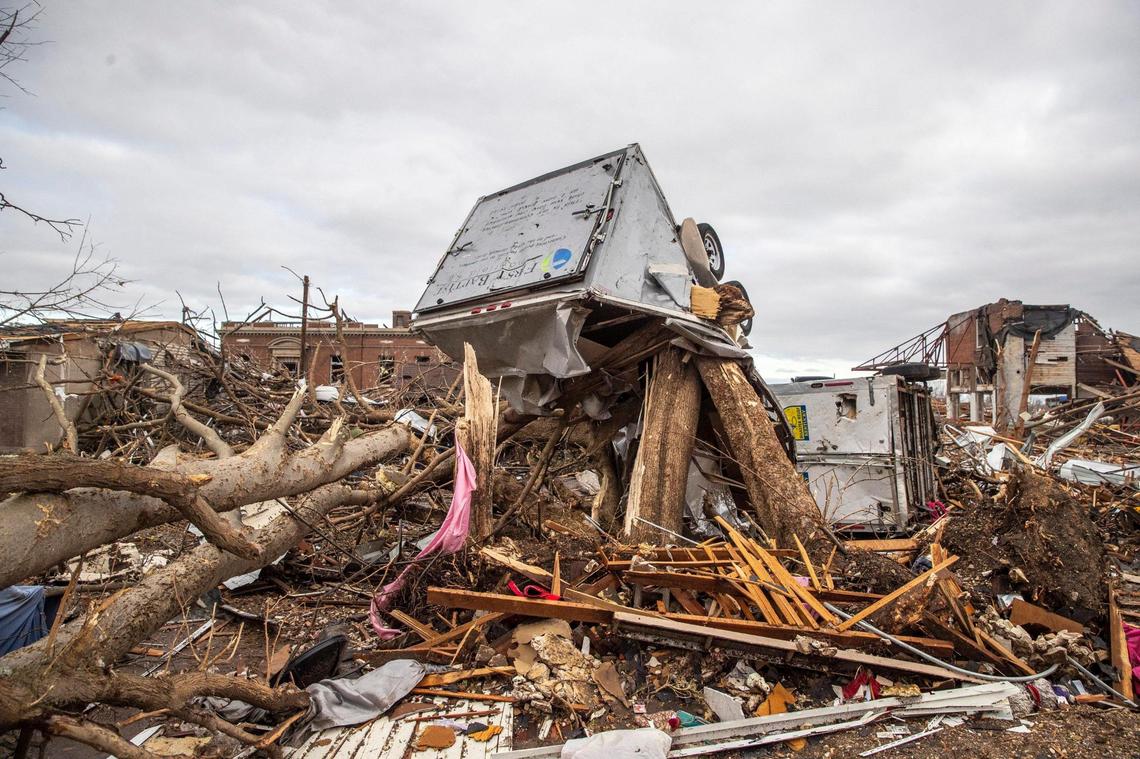 Buildings are demolished in downtown Mayfield, Ky., on Saturday, Dec. 11, 2021, after a tornado traveled through the region Friday night.