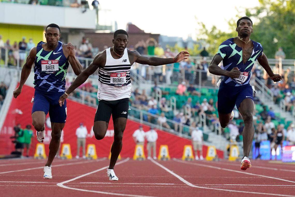Trayvon Bromell, center, outran Ronnie Baker, left, and Fred Kerley in men’s 100-meter dash at the U.S. Olympic Trials on Sunday in Eugene, Ore.