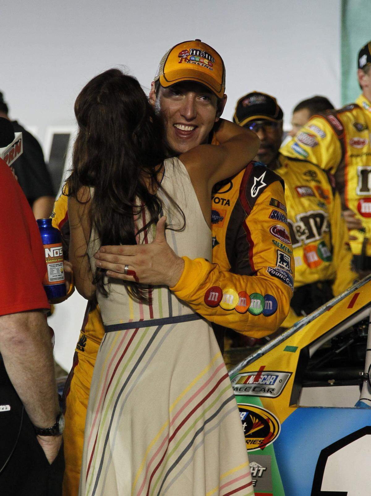 Kyle Busch got a hug from his wife, Samantha, after winning the inaugural NASCAR Cup Series Quaker State 400 at Kentucky Speedway in 2011.