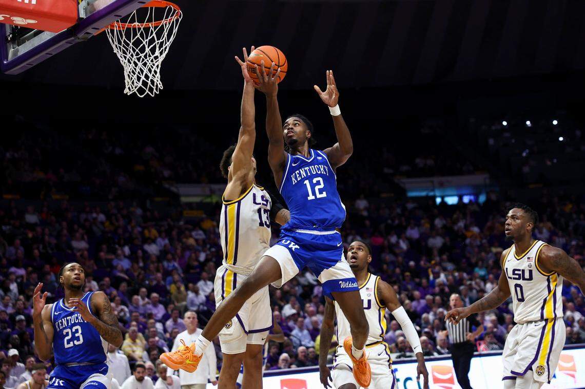 Kentucky’s Antonio Reeves (12) drives against LSU’s Jalen Reed (13) during Wednesday’s game at the Pete Maravich Assembly Center in Baton Rouge, Louisiana.