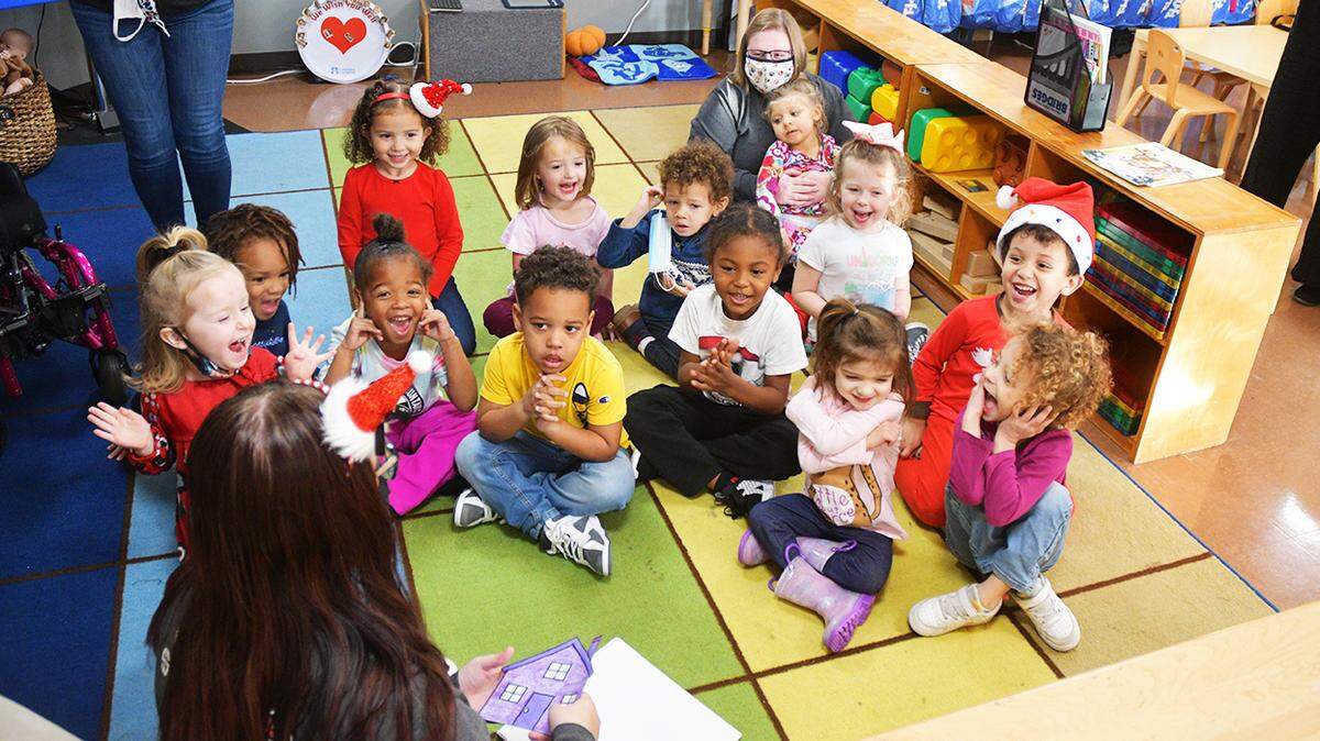 Children in the early Head Start program at Audubon Area Head Start on the east side of Owensboro participate in a group discussion.