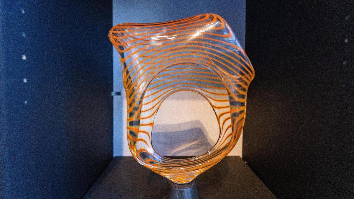Blown glass artwork by artist Travis Adams titled ‘Sultry Striation’ featured in the gallery space within the Trifecta Glass Art Lounge on Walton Avenue.