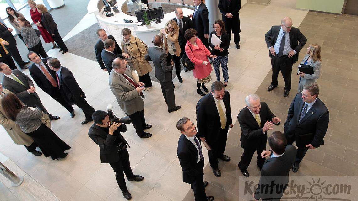 Gov. Steve Beshear, gesturing at bottom right, mingled during the grand opening of Tempur-Pedic's new headquarters in Lexington.  Photo by Pablo Alcala | Staff