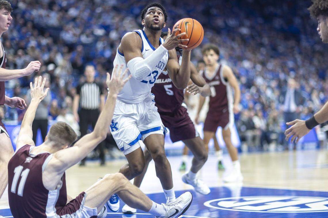 Kentucky Wildcats forward Mouhamed Dioubate (23) shoots as Bellarmine Knights forward Brian Waddell (11) falls to the court during a game at Rupp Arena on Tuesday.