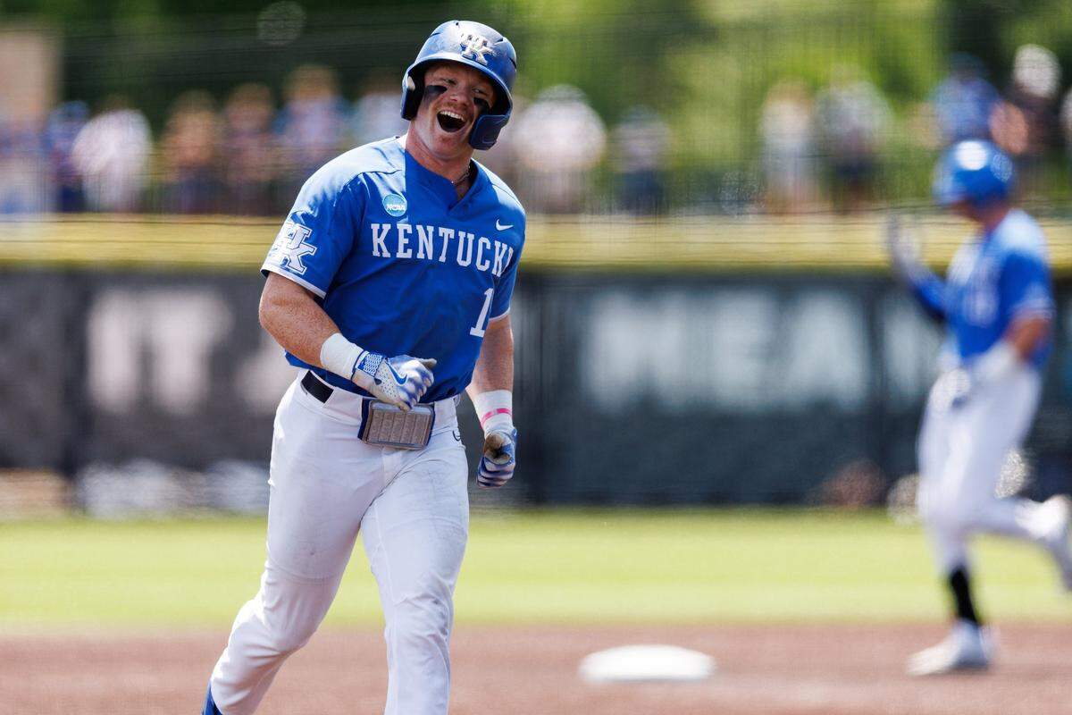 May 31, 2024; Lexington, KY, USA; Kentucky outfielder Nolan McCarthy (19) celebrates as he runs the bases after infielder James McCoy (13) hits a home run to score two runs during the second inning of an NCAA Division I Baseball Championship game between the Kentucky Wildcats and Western Michigan Broncos at Kentucky Proud Park. Mandatory Credit: Jordan Prather-USA TODAY Sports