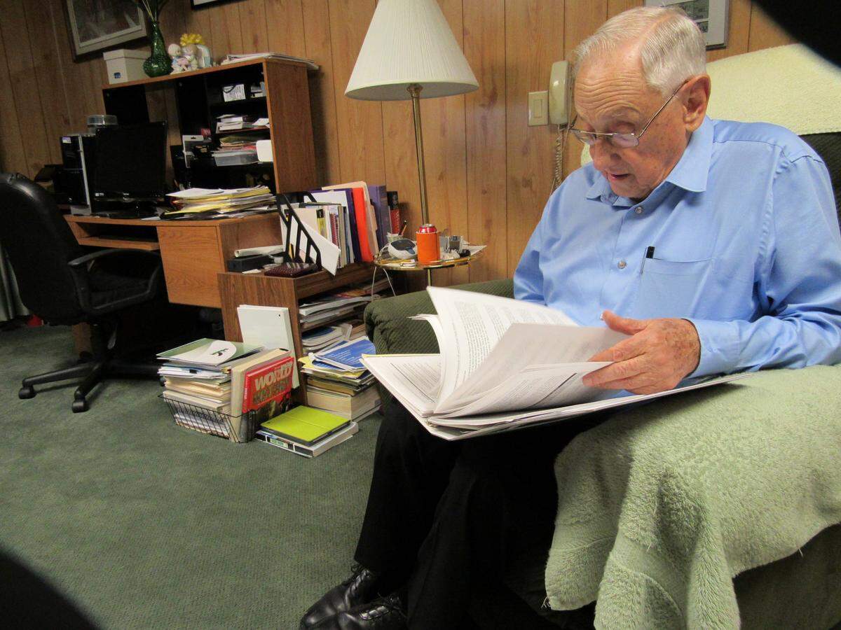 Elwood Cornett looked over the final environmental impact statement on the proposed prison in Letcher County in 2015. Local planners pushed for the project for years.
