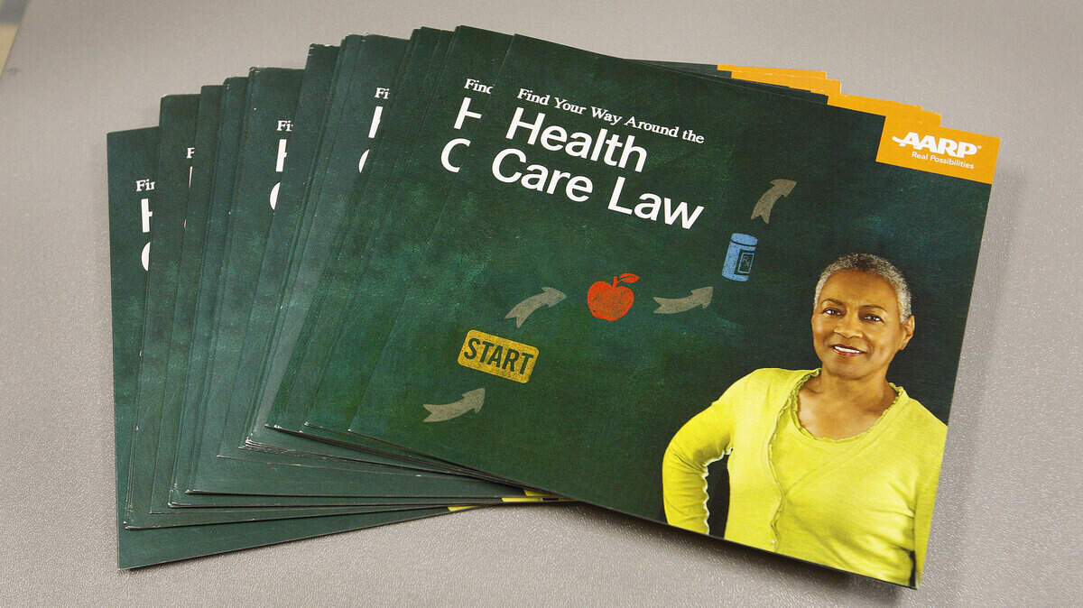 Literature about enrolling for health insurance under the Affordable Care Act at the Fayette Co. Extension Office in Lexington, Ky., Thursday, November 14, 2013. The event was sponsored by AARP and the Lexington-Fayette Co. Health Department. Photo by Matt Goins