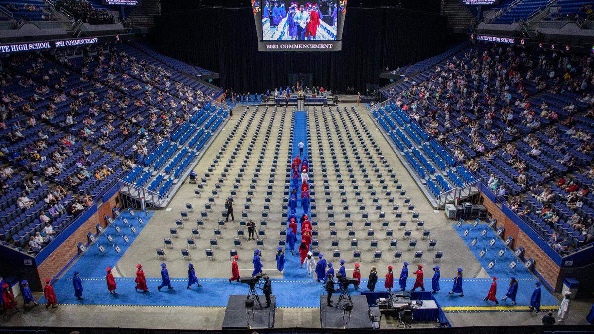 Graduating students of Lafayette High School walk to their seats during the precessional for Lafayette High Schools 2021 commencement ceremony at Rupp Arena in Lexington, Ky., on Wednesday, May 19, 2021.