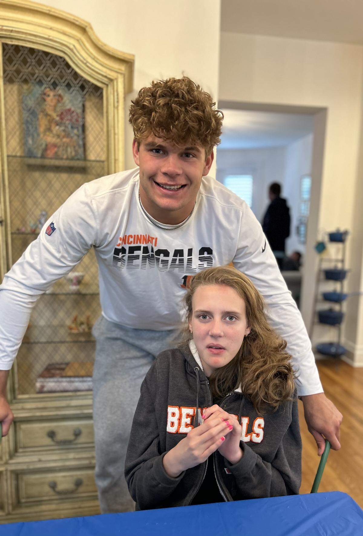 Kentucky tight end Willie Rodriguez, standing, draws inspiration from his younger sister Gabby, who has Rett syndrome, a rare neurological disorder caused by genetic mutations that disrupt brain development. “Growing up, her as my little sister, just put a lot of things in perspective for me,” Willie Rodriguez said. “It made me very grateful for my life. Me and my whole family, we see Gabby as a blessing.”