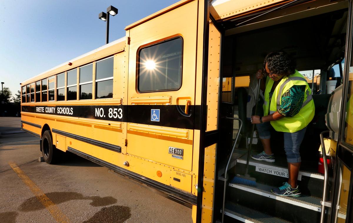Bus monitor Valerie Smothers used a broom to sweep bus no. 853 Monday morning at the Fayette County School bus garage, 780 Miles Point Way. According to Marcus Dobbs, Director of Transportation, 241 buses ran their route this morning. They have 285 buses in the fleet that transports about 20,000 students. Fayette County starts school Wednesday August 15th, the same day University of Kentucky students start moving in for the fall semester.
