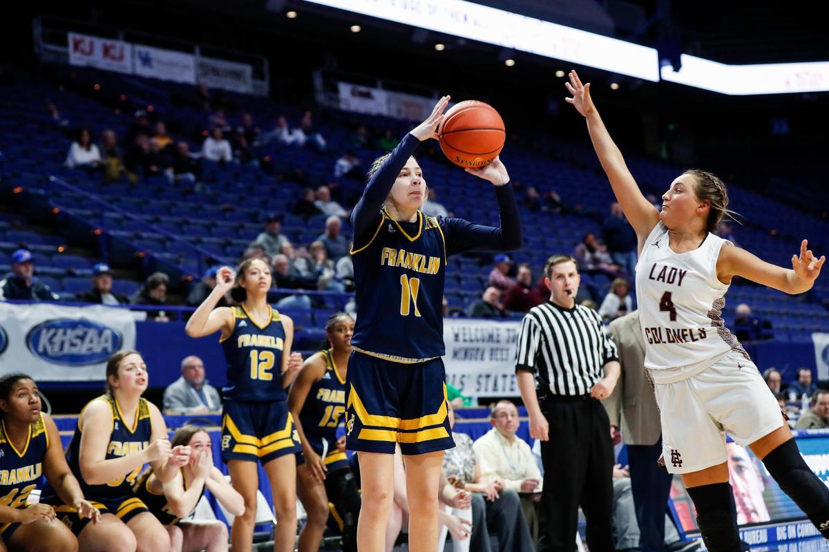 Franklin County freshman Cameryn Ridderikhoff (11) makes a three-pointer over Henderson County’s Savannah Lacer (4) late in Wednesday night’s win. “I think we were all shocked that we were up one and we fired one from 30 feet.” Coach Joey Thacker said. “But it worked out.”