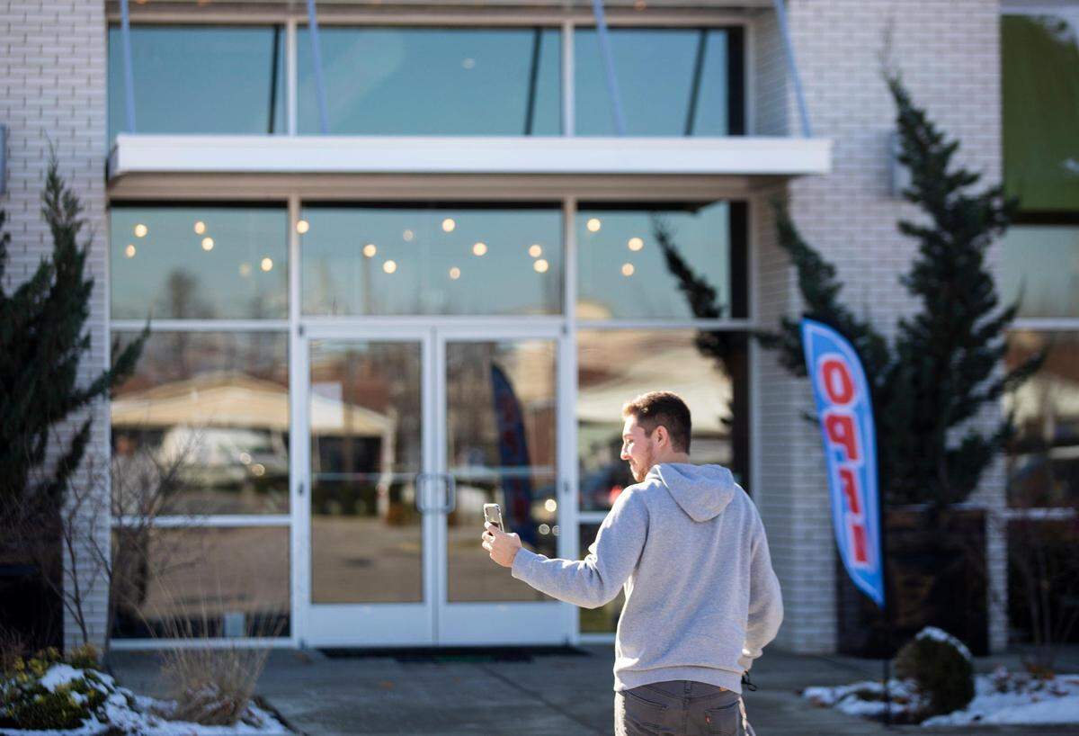 A patron took a selfie before entering Brewed in Lexington Wednesday. The coffee shop and bar has been operating in defiance of Gov. Andy Beshear’s mandates to close to in-person dining due to the coronavirus. The owner said later Wednesday that he’s stopping food and beverage services to comply with a court order.