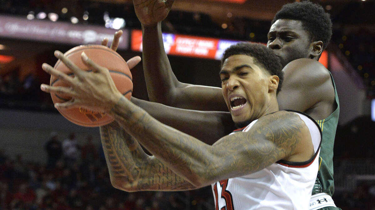 Louisville forward Ray Spalding grabbed a rebound away from Siena forward Prince Oduro during the first half on Dec. 6, 2017, in Louisville.