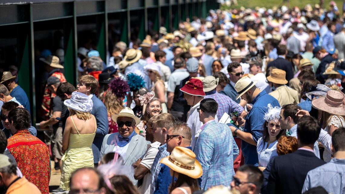 With masks often on chins, Derby crowd comes back smaller, subdued but a bit of normal