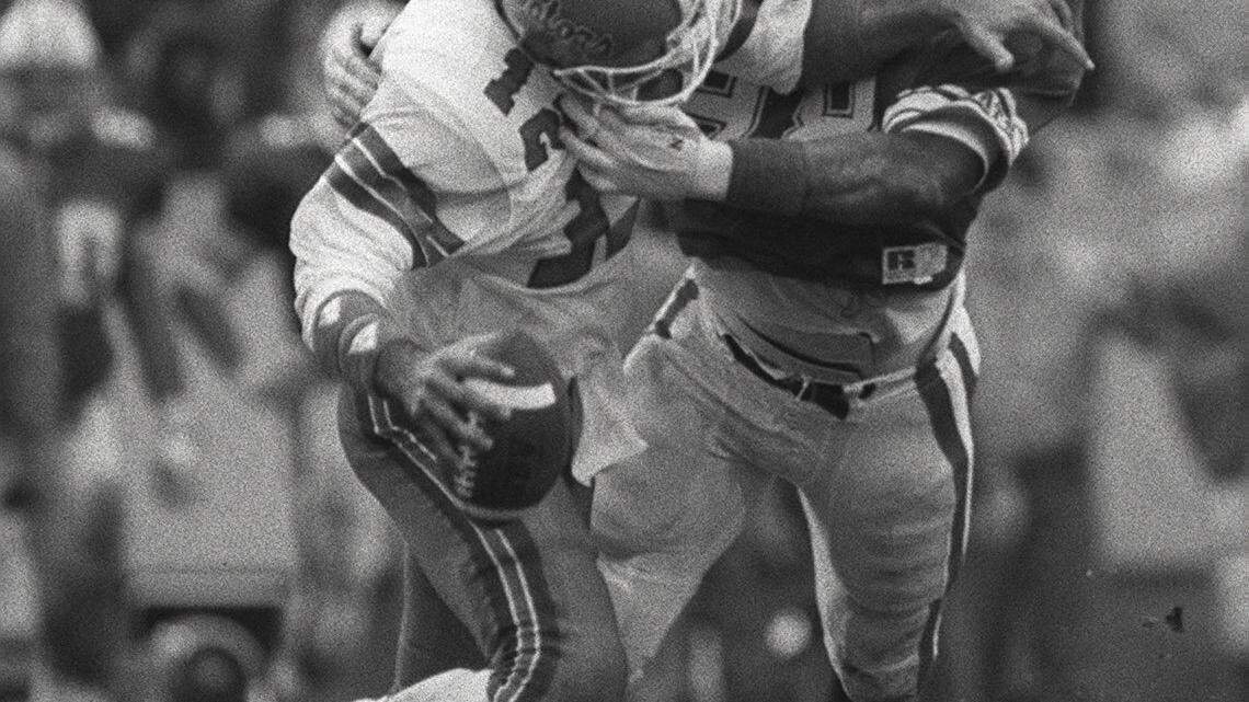 The University of Kentucky's Carwell Gardner sacked Florida's Kerwin Bell during UK's 10-3 victory over the University of Florida on Nov. 15, 1986, at Commonwealth Stadium in Lexington.