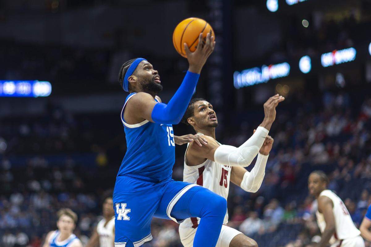 Kentucky Wildcats forward Ansley Almonor (15) drives the ball as Alabama Crimson Tide forward Jarin Stevenson (15) defends during a game at Bridgestone Arena in Nashville, Tenn., on Friday, March 14, 2025.  