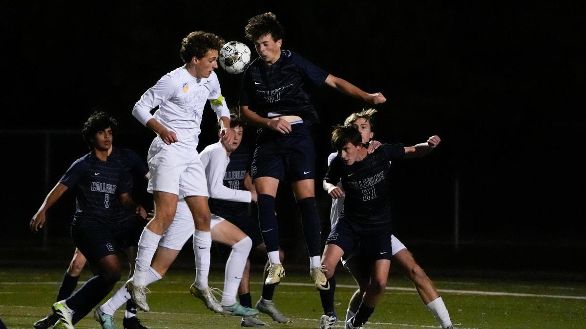 Henry Clay’s Marco Messerli (7) and Louisville Collegiate’s Carter Sipes battle for the ball during the Blue Devils’ 6-1 win in the state tournament championship game at Paul Laurence Dunbar High School.