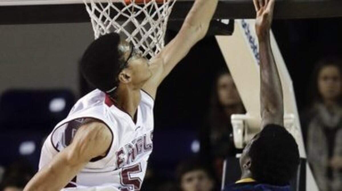 Evangecial Christian School's Skal Labissiere, left, blocked a shot in Tennessee's Class A title game. The Haiti native received UK's first Class of 2015 scholarship offer.      